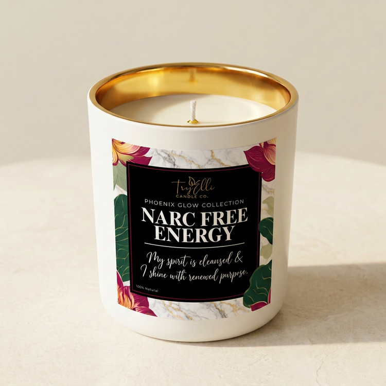 Narc Free Energy candle from the Phoenix Glow Collection in an ivory jar with a gold interior